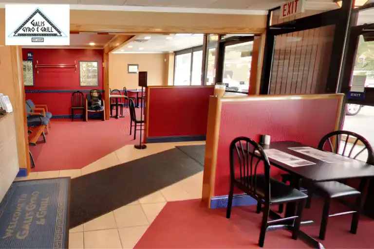 Greek restaurant dining area with red booths and seating
