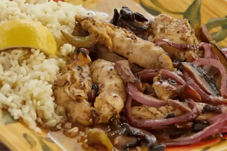 Greek and Mediterranean restaurant serving grilled chicken with rice and fresh toppings
